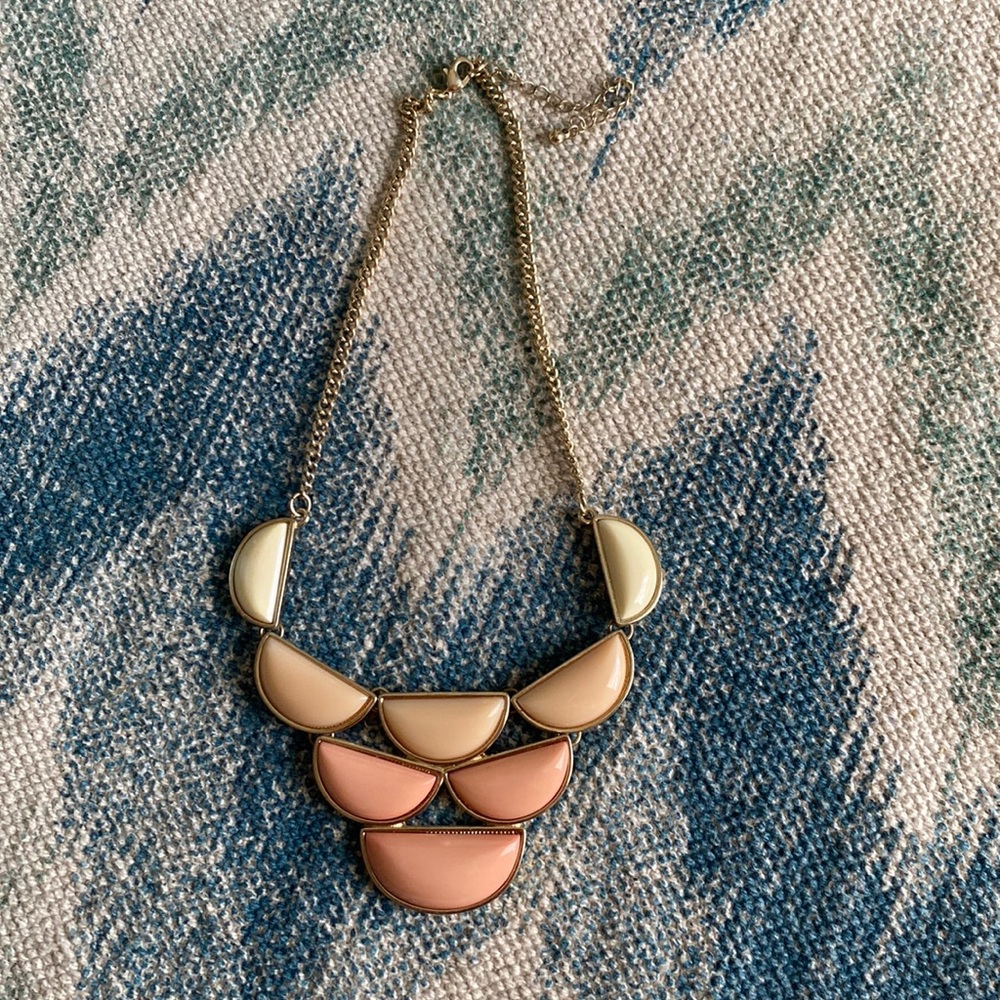 necklace with ombré cream to pink half-circle pattern with gold trim